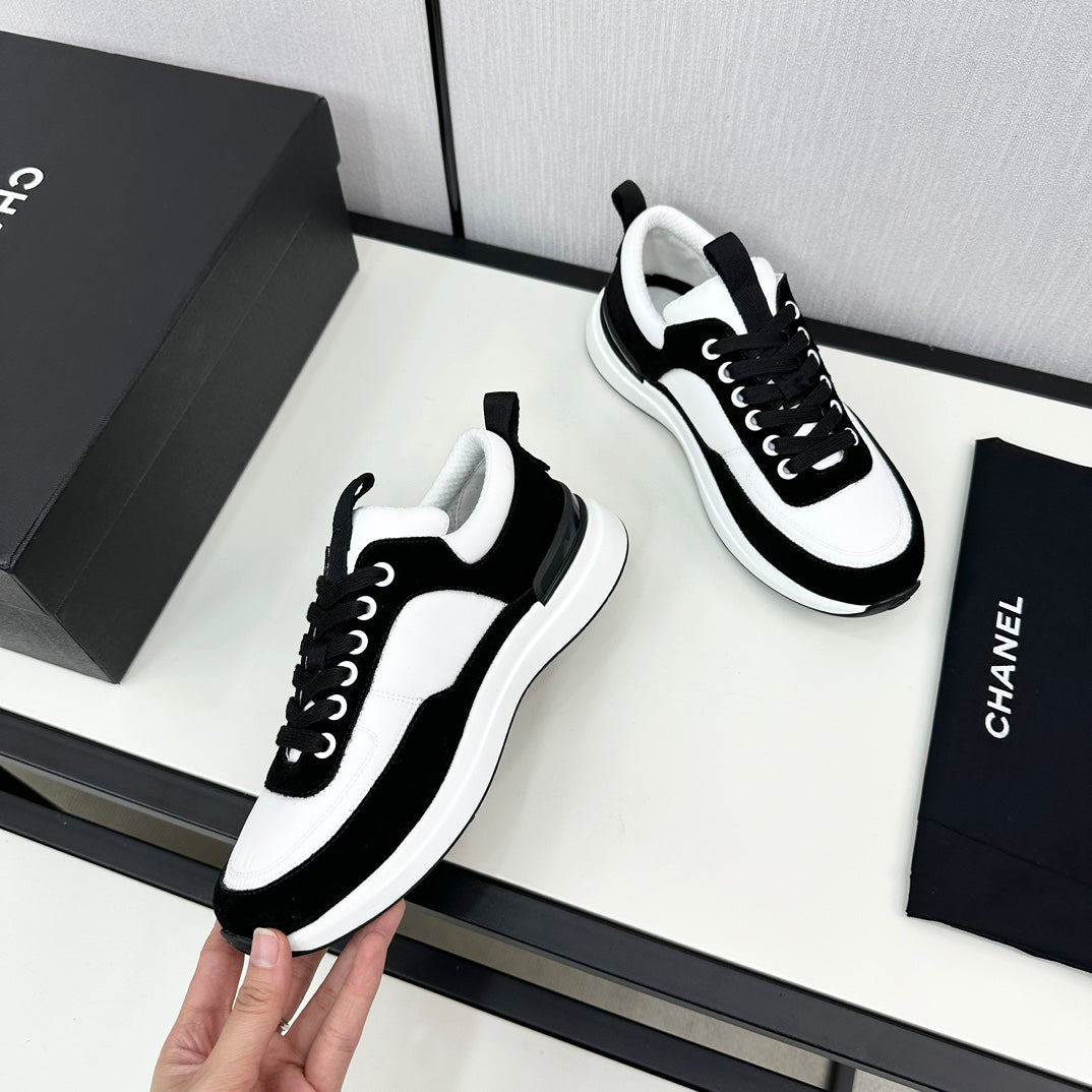 CHANEL SNEAKER IN BLACK SUEDE AND WHITE CALFSKIN
